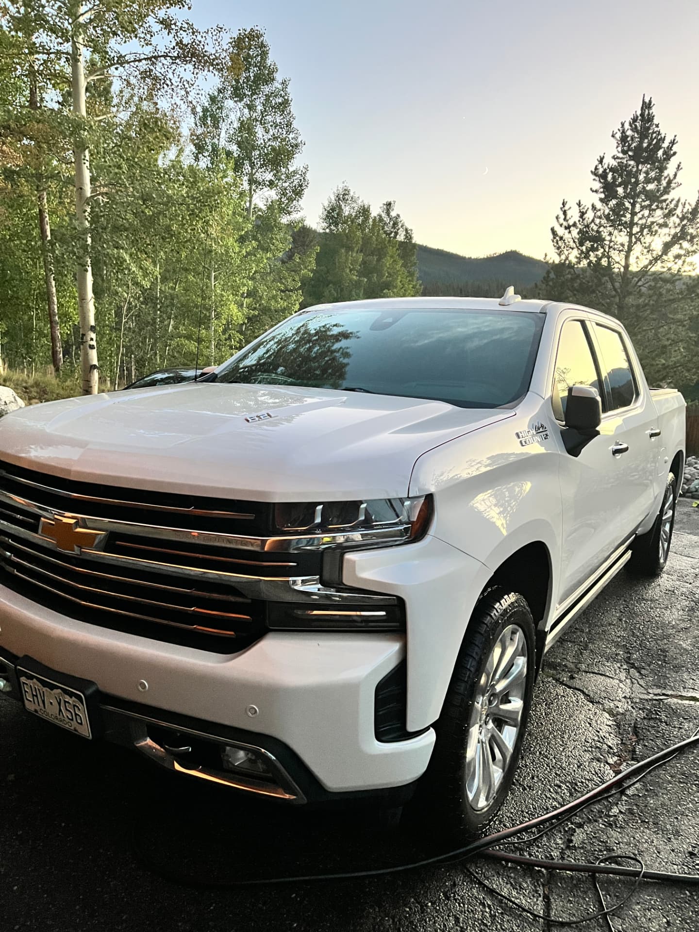 Freshly detailed white Chevrolet Silverado in the Colorado mountains