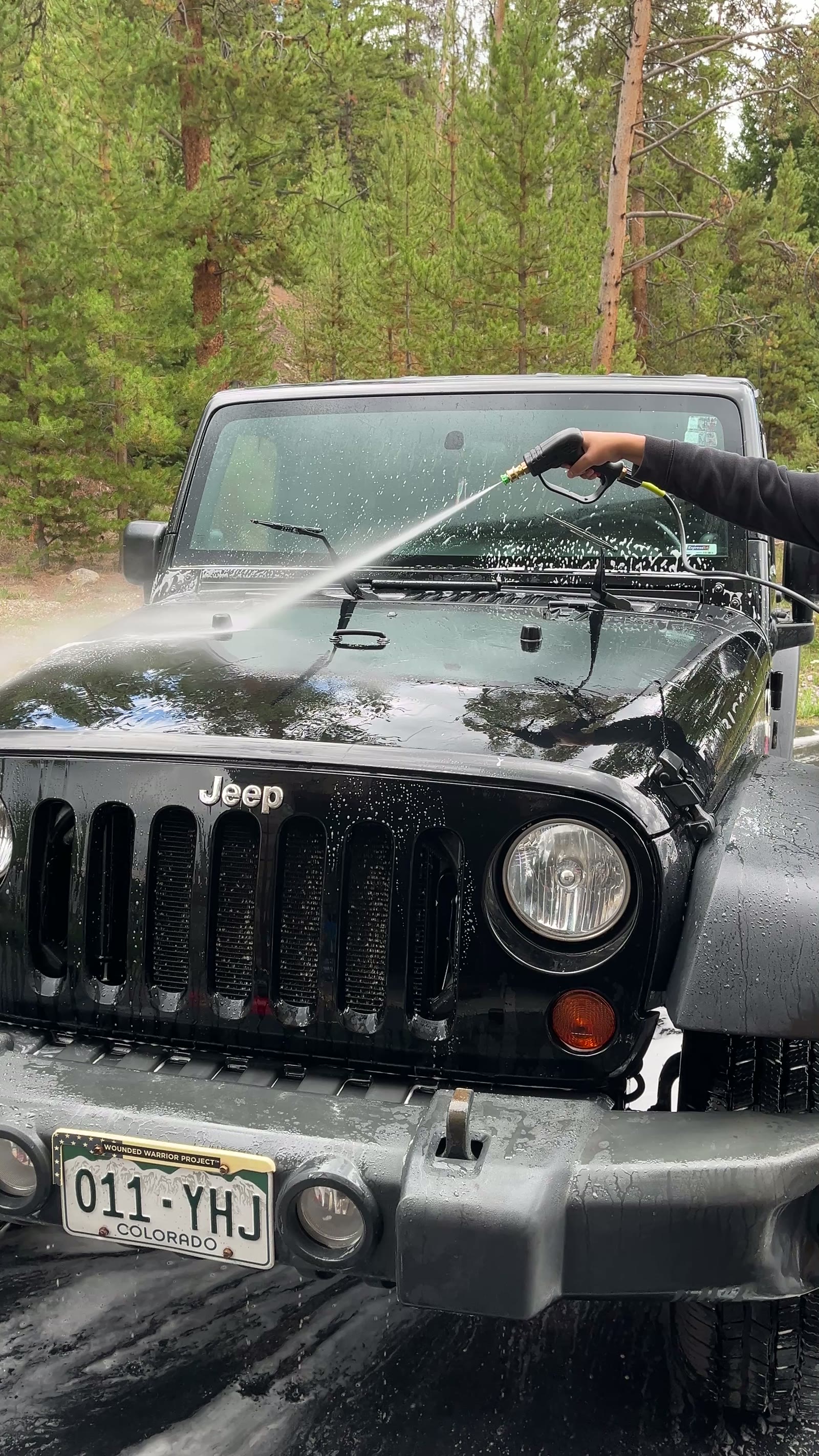 Jeep Wrangler being pressure-washed during a Vortan mobile exterior detail in Summit County, Colorado