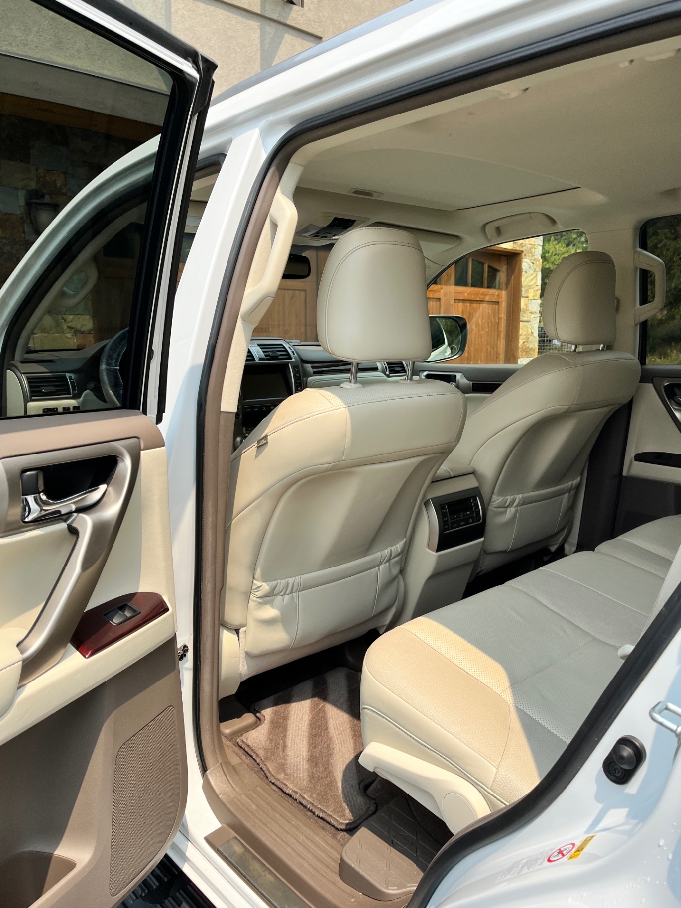Clean white leather interior of a Lexus GX after detailing