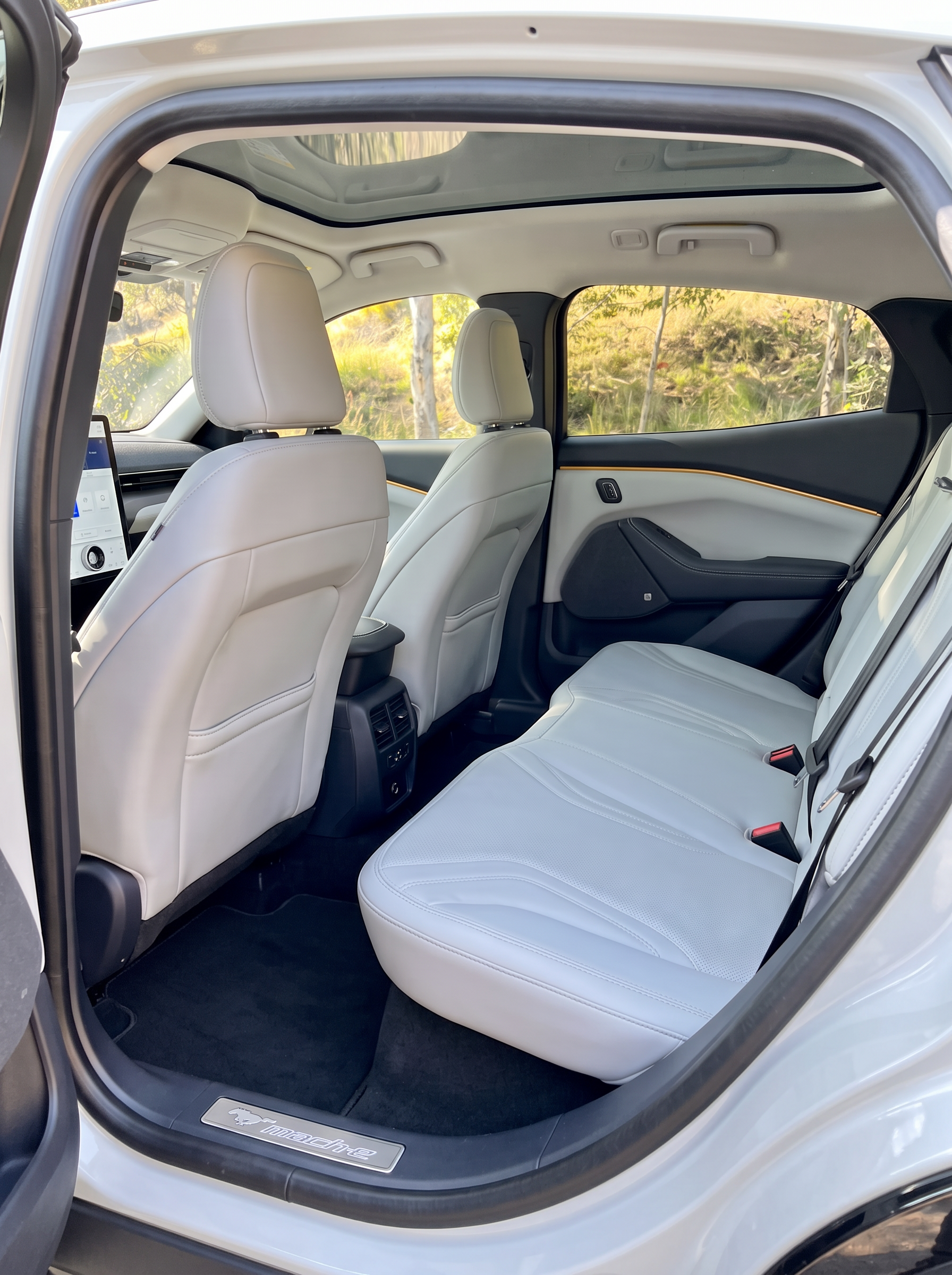 Freshly detailed white Mustang Mach-E rear interior with clean seats