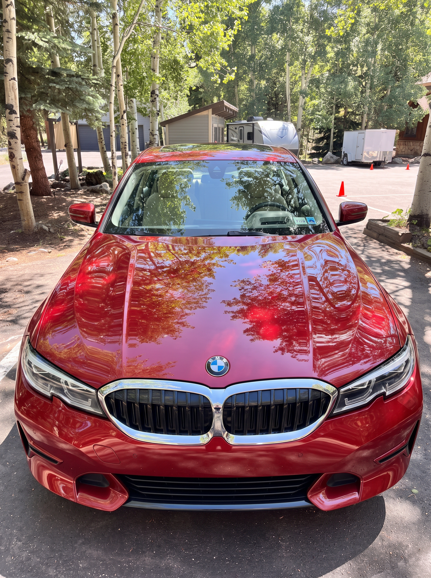 Glossy red BMW sedan after a Vortan hand wash and wax