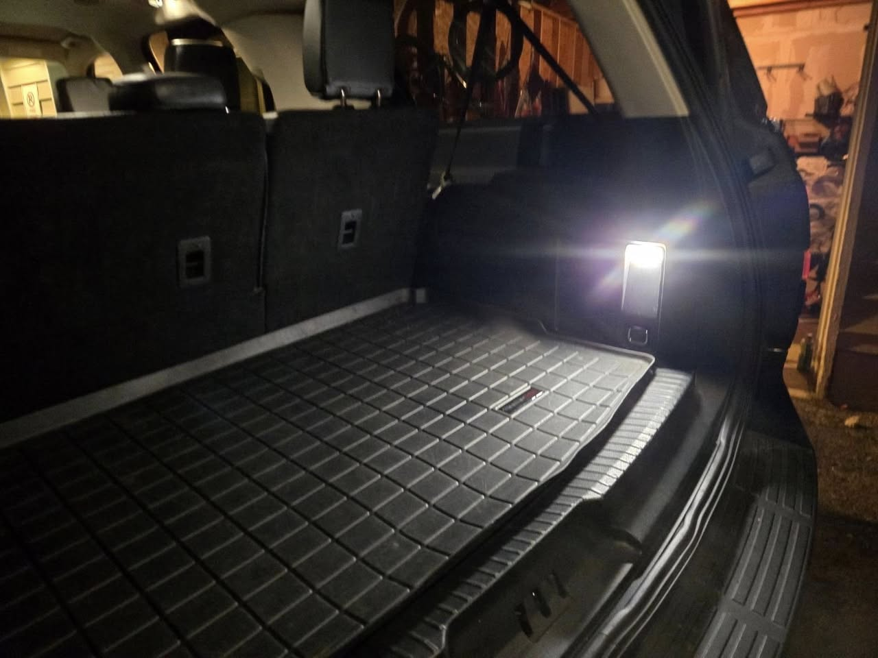 Spotless SUV cargo area with clean all-weather mat after Vortan interior detail